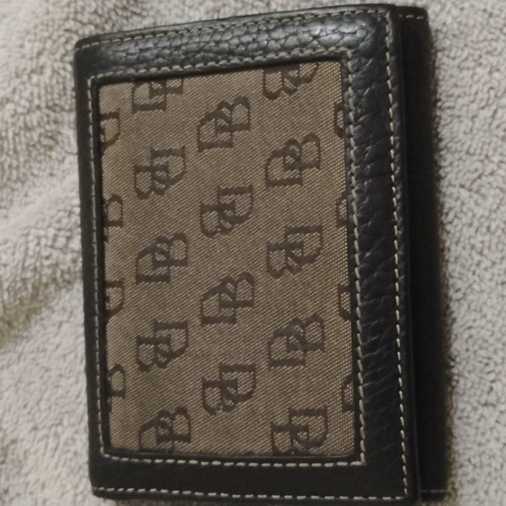 Dooney & Bourke tri fold  black. leatherWallet.